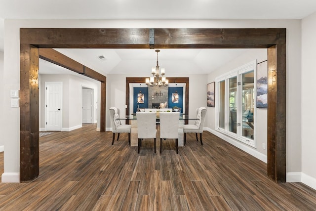 101 Explorer Cv, Lakeway, TX 78734 - dining room featuring a chandelier, baseboards, and dark wood-type flooring