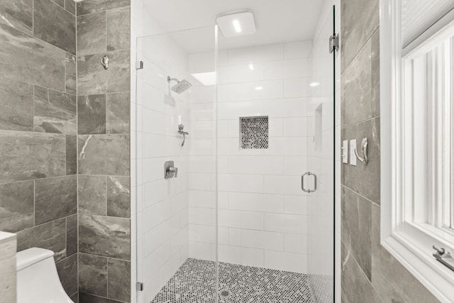101 Explorer Cv, Lakeway, TX 78734 - bathroom featuring a shower stall and toilet