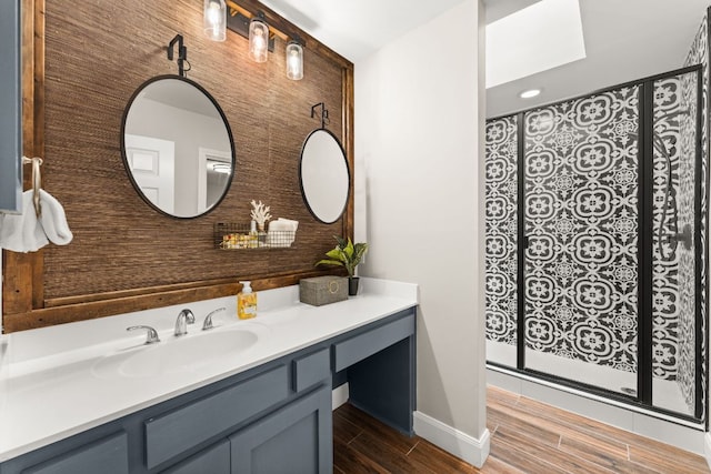 101 Explorer Cv, Lakeway, TX 78734 - full bathroom featuring vanity, wood finish floors, a shower with curtain, and baseboards