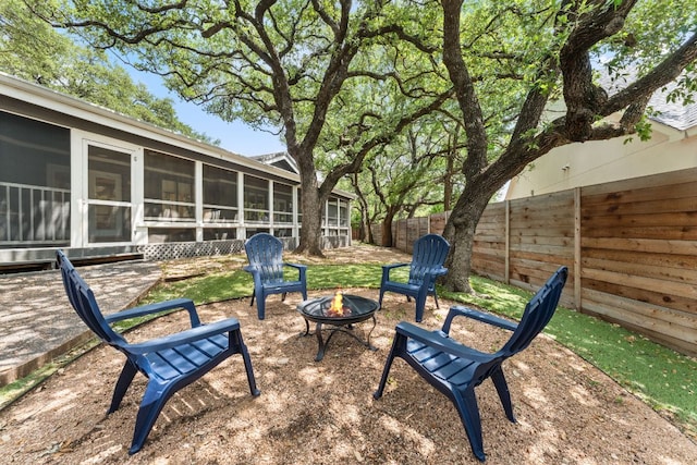 101 Explorer Cv, Lakeway, TX 78734 - fenced backyard featuring a fire pit and a sunroom