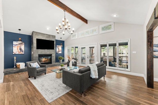 101 Explorer Cv, Lakeway, TX 78734 - living area with beamed ceiling, a chandelier, high vaulted ceiling, a stone fireplace, and baseboards
