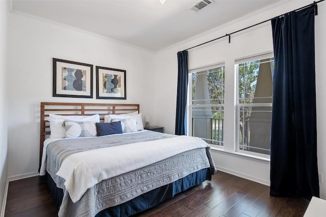 415 Angel Fire Rd, Dripping Springs, TX 78620 - bedroom with baseboards, dark wood-style floors, and ornamental molding