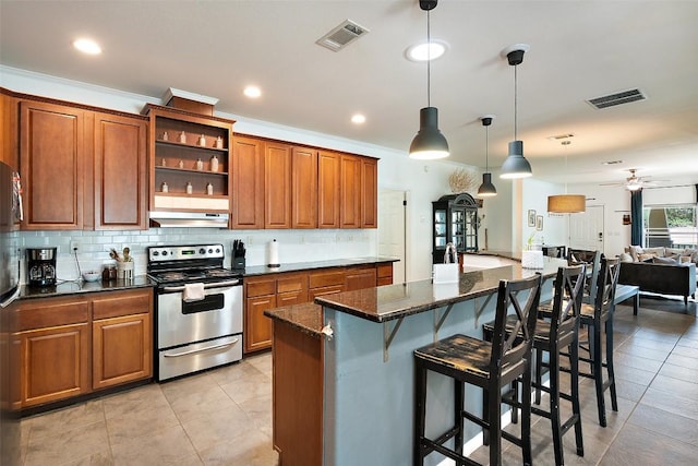 415 Angel Fire Rd, Dripping Springs, TX 78620 - kitchen with stainless steel electric range, range hood, brown cabinets, backsplash, and recessed lighting