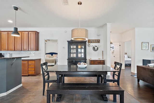 415 Angel Fire Rd, Dripping Springs, TX 78620 - dining space with crown molding and baseboards