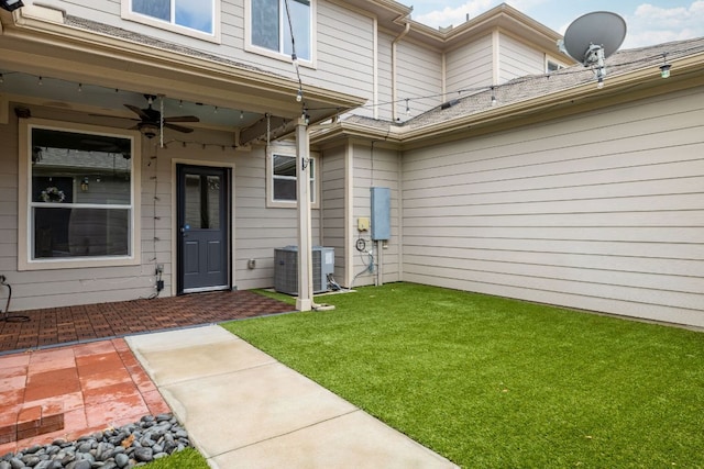 402 Crater Lake Dr, Pflugerville, TX 78660 - entrance to property with central AC unit, ceiling fan, and a lawn