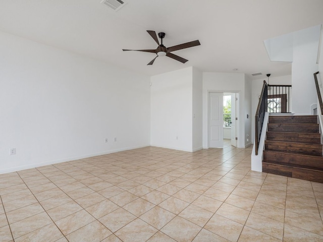402 Crater Lake Dr, Pflugerville, TX 78660 - spare room featuring ceiling fan, stairway, light tile patterned flooring, and baseboards