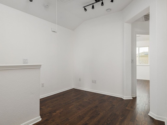 402 Crater Lake Dr, Pflugerville, TX 78660 - empty room featuring hardwood / wood-style floors, a smoke detector, lofted ceiling, rail lighting, and baseboards