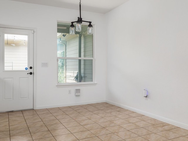 402 Crater Lake Dr, Pflugerville, TX 78660 - unfurnished dining area featuring baseboards and light tile patterned floors