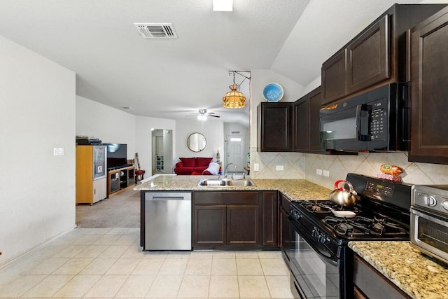 166 Tallow Trl, San Marcos, TX 78666 - kitchen featuring black appliances, vaulted ceiling, open floor plan, a peninsula, and dark brown cabinets