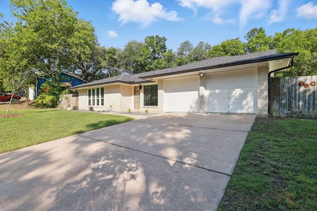 8506 Shenandoah Dr, Austin, TX 78753 - view of front of house featuring concrete driveway, an attached garage, brick siding, and a shingled roof