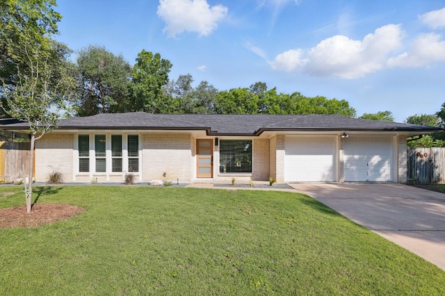 8506 Shenandoah Dr, Austin, TX 78753 - mid-century inspired home featuring a garage, driveway, and brick siding
