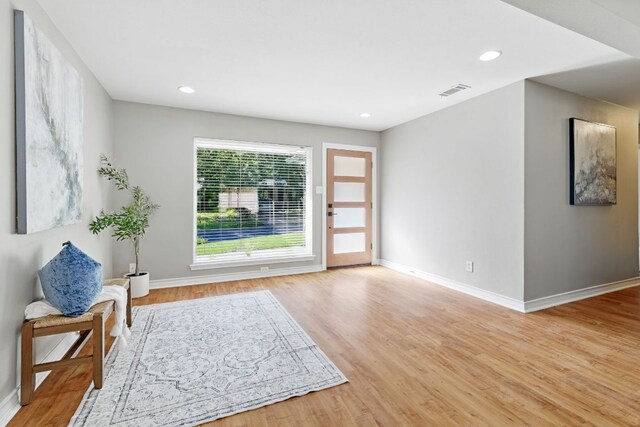 8506 Shenandoah Dr, Austin, TX 78753 - entryway featuring baseboards, wood finished floors, and recessed lighting
