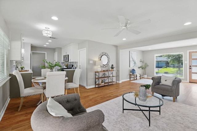 8506 Shenandoah Dr, Austin, TX 78753 - living room with light wood-style floors, a ceiling fan, recessed lighting, and baseboards