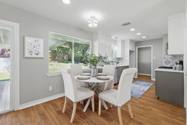 8506 Shenandoah Dr, Austin, TX 78753 - dining area with light wood finished floors, baseboards, and recessed lighting