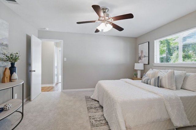 8506 Shenandoah Dr, Austin, TX 78753 - bedroom with light carpet, baseboards, and a ceiling fan