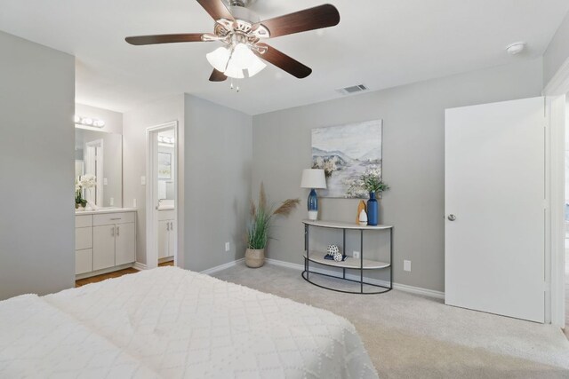 8506 Shenandoah Dr, Austin, TX 78753 - carpeted bedroom with baseboards, ensuite bath, and ceiling fan