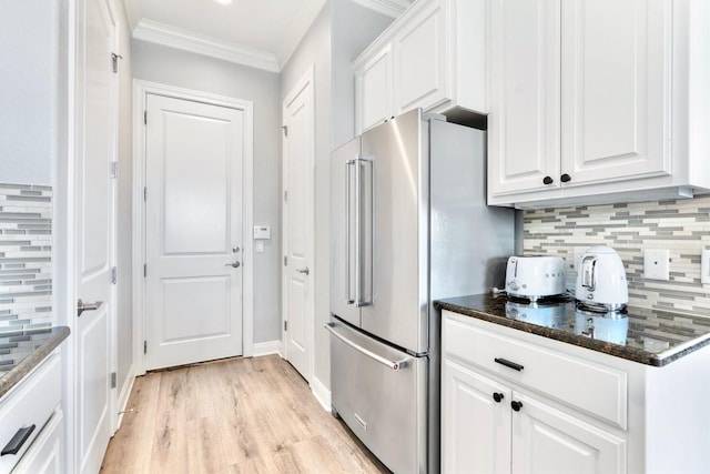 4000 Ranch Road 620 N Unit 7, Austin, TX 78734 - kitchen featuring high end fridge, ornamental molding, decorative backsplash, white cabinetry, and light wood finished floors
