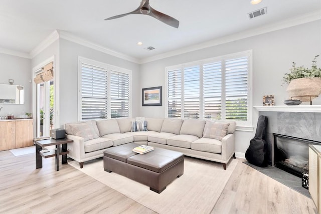 4000 Ranch Road 620 N Unit 7, Austin, TX 78734 - living area featuring light wood finished floors, a ceiling fan, ornamental molding, a fireplace, and recessed lighting
