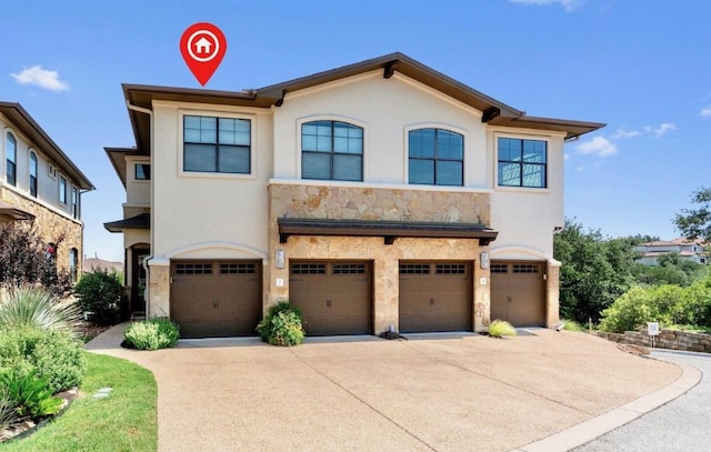 4000 Ranch Road 620 N Unit 7, Austin, TX 78734 - view of front facade featuring stone siding, an attached garage, concrete driveway, and stucco siding