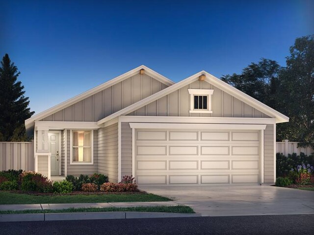 800 Sun Grove Trl, Andice, TX 78628 - view of front of home featuring driveway, board and batten siding, and an attached garage