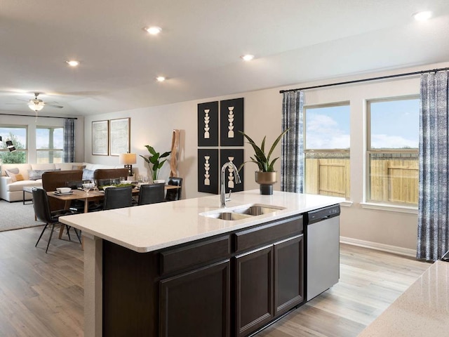 800 Sun Grove Trl, Andice, TX 78628 - kitchen featuring dishwasher, a sink, open floor plan, a center island with sink, and ceiling fan
