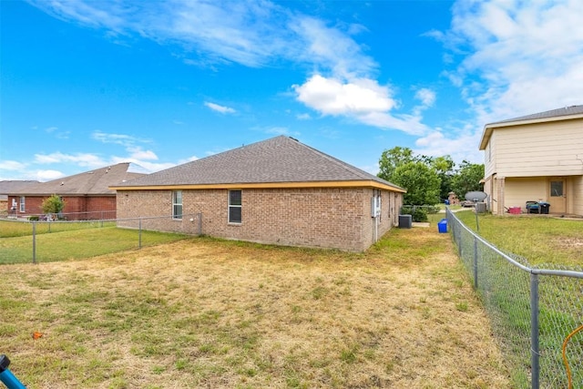 308 Janelle Drive A And B, Copperas Cove, TX 76522 - view of property exterior featuring a fenced backyard, brick siding, and roof with shingles