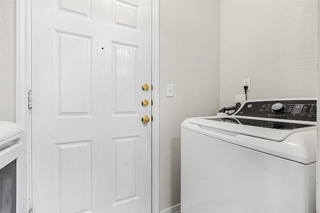 308 Janelle Drive A And B, Copperas Cove, TX 76522 - laundry area featuring washer / dryer and a textured wall
