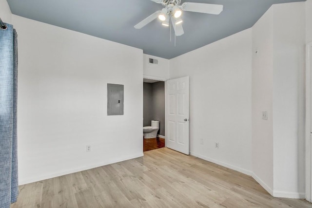 2320 Gracy Farms Ln Unit 1024, Austin, TX 78758 - unfurnished bedroom featuring electric panel, wood finished floors, baseboards, and a ceiling fan