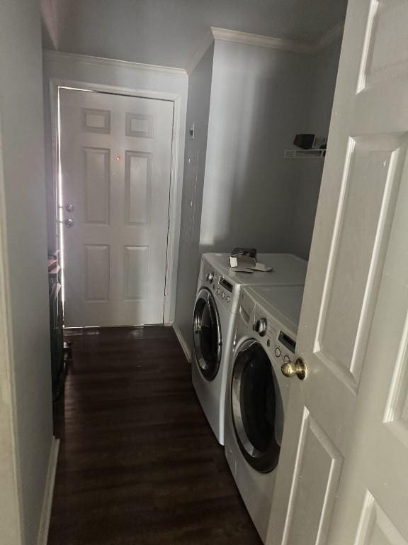 8403 Riverstone Dr, Austin, TX 78724 - laundry area featuring independent washer and dryer, ornamental molding, dark wood-type flooring, and baseboards