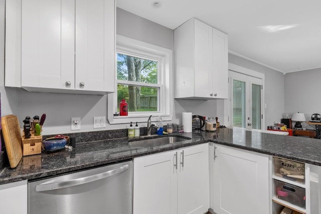 5205 Buffalo Pass, Austin, TX 78745 - kitchen featuring stainless steel dishwasher, a sink, white cabinetry, and ornamental molding