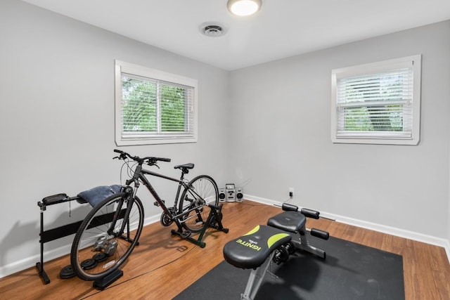 5205 Buffalo Pass, Austin, TX 78745 - workout room with baseboards and wood finished floors