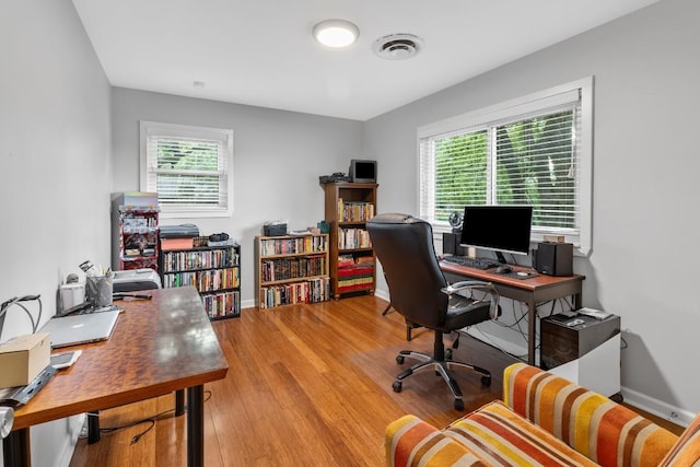 5205 Buffalo Pass, Austin, TX 78745 - office space featuring plenty of natural light, light wood-style floors, and baseboards