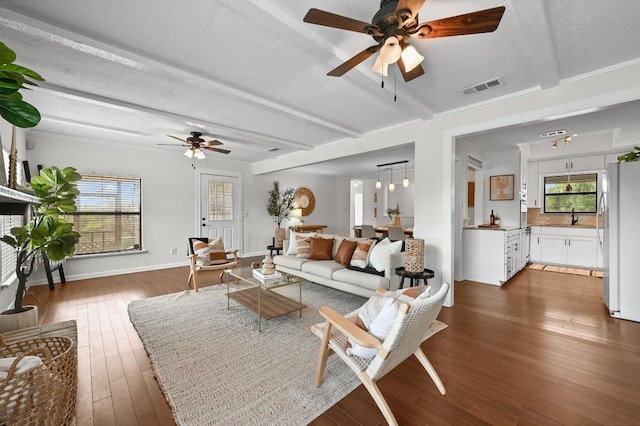 2018 Chaparral Park Rd, Manchaca, TX 78652 - living area featuring a ceiling fan, dark wood-type flooring, and beamed ceiling