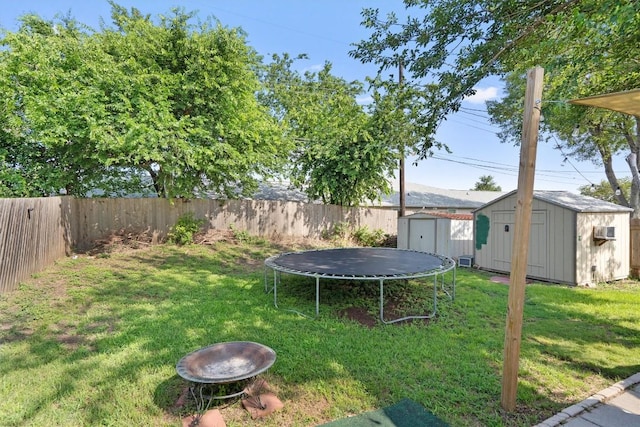 2000 Holly Springs Dr, Taylor, TX 76574 - fenced backyard featuring a storage unit and a trampoline