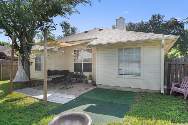 2000 Holly Springs Dr, Taylor, TX 76574 - back of property with a chimney, a patio area, and roof with shingles
