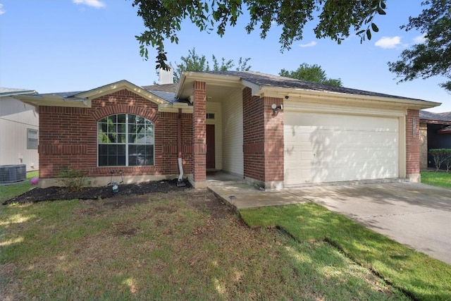 2000 Holly Springs Dr, Taylor, TX 76574 - ranch-style house with brick siding, a garage, driveway, and a front yard