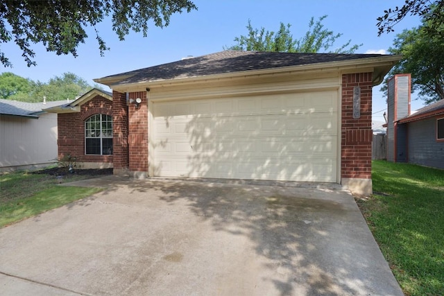 2000 Holly Springs Dr, Taylor, TX 76574 - view of home's exterior featuring brick siding, a garage, and concrete driveway