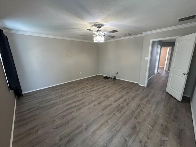 125 Lilly Crk, Boerne, TX 78006 - spare room featuring ceiling fan, dark wood-type flooring, baseboards, ornamental molding, and a textured ceiling