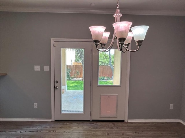 125 Lilly Crk, Boerne, TX 78006 - doorway to outside featuring a chandelier, wood finished floors, crown molding, and baseboards