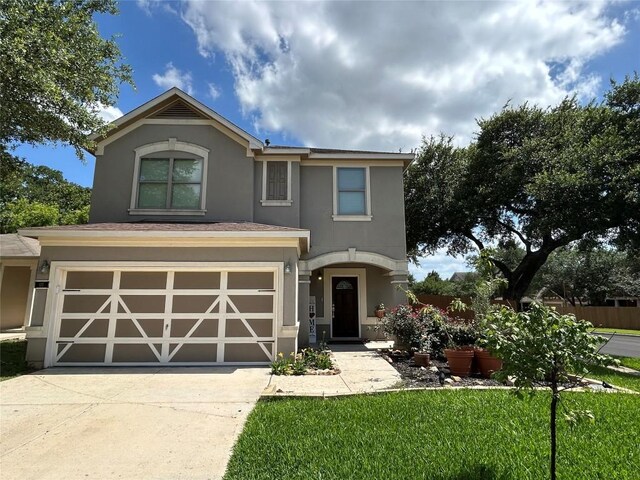 125 Lilly Crk, Boerne, TX 78006 - view of front facade featuring stucco siding, concrete driveway, a garage, and a front lawn