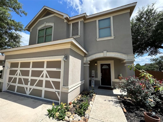125 Lilly Crk, Boerne, TX 78006 - view of front facade with stucco siding, a garage, and driveway