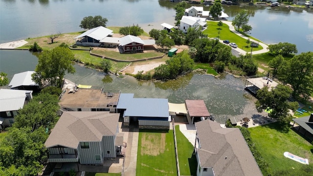 aerial view of residential area featuring a nearby body of water