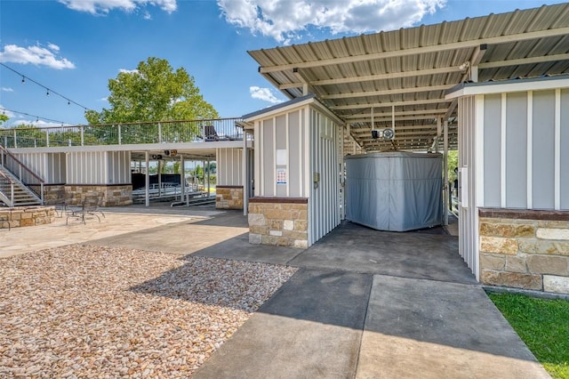 view of patio / terrace featuring an attached carport and driveway