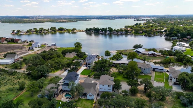 aerial view of residential area featuring a nearby body of water