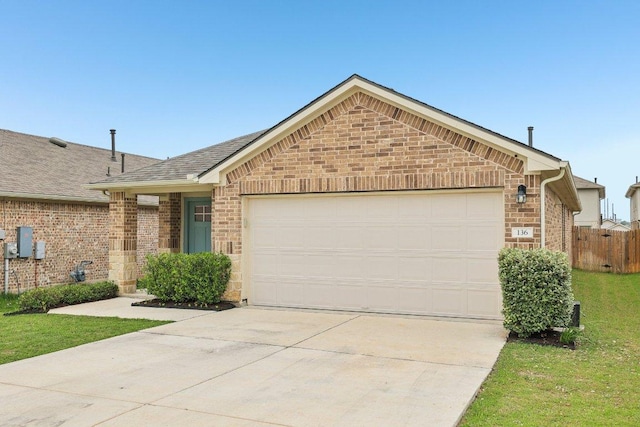 136 Ellinger Rd, Georgetown, TX 78626 - ranch-style house featuring an attached garage, driveway, brick siding, and roof with shingles