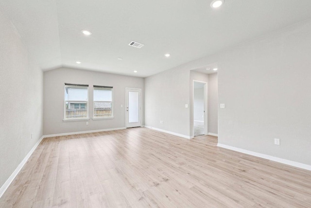 136 Ellinger Rd, Georgetown, TX 78626 - spare room with light wood-style flooring, recessed lighting, baseboards, and lofted ceiling