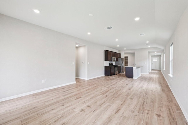 136 Ellinger Rd, Georgetown, TX 78626 - unfurnished living room with recessed lighting, light wood-style floors, and baseboards