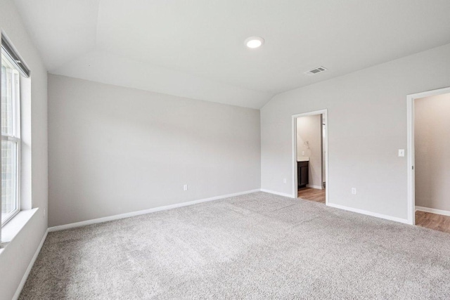 136 Ellinger Rd, Georgetown, TX 78626 - unfurnished room featuring carpet floors, vaulted ceiling, plenty of natural light, and baseboards