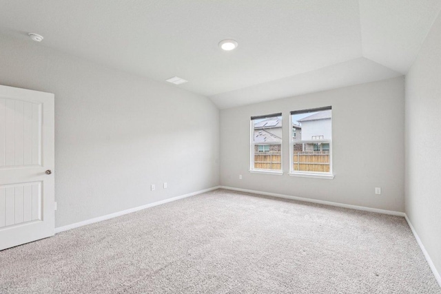 136 Ellinger Rd, Georgetown, TX 78626 - carpeted empty room featuring vaulted ceiling, baseboards, and a smoke detector