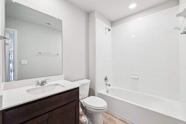 136 Ellinger Rd, Georgetown, TX 78626 - full bath with toilet, vanity,  shower combination, and wood finished floors